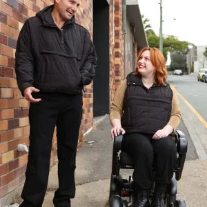 Matt Adaptive Puffer Vest with travel pillow design for wheelchair users